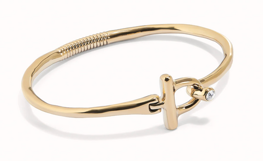 rigid bracelet with front closure of metal alloy plated in gold 18k with white topaz M