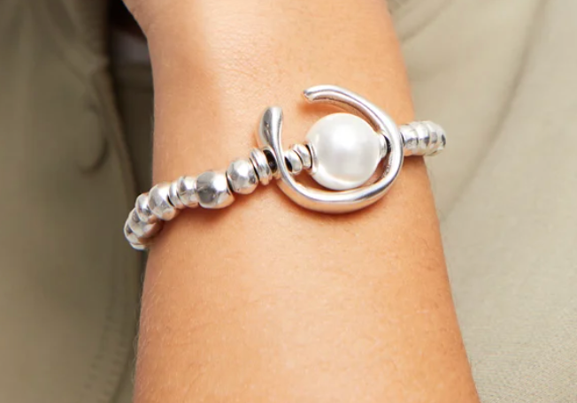metal bracelet clad with sterling silver with pearl.