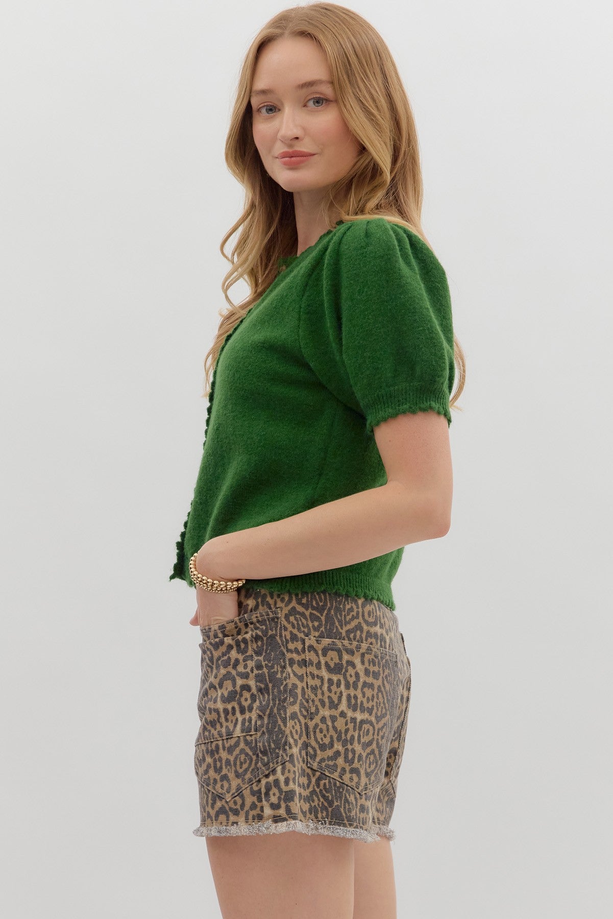 Solid short puff sleeve sweater knit top featuring scallop accent edge